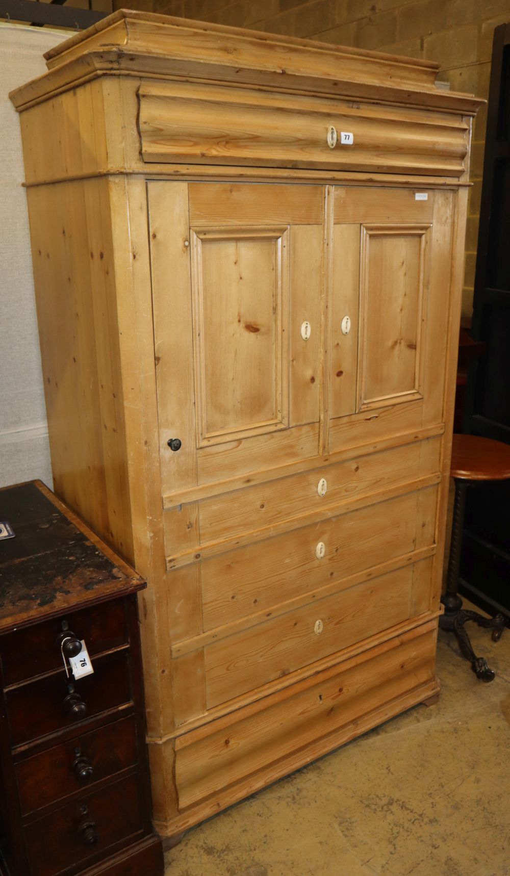 A 19th century Continental pine hanging cupboard with dummy drawer cupboard front, W.98cm, D.53cm, H.174cm